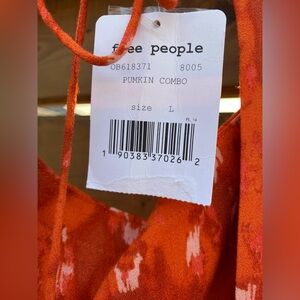 Cute Free people cap sleeve mini dress size large.  NWT.